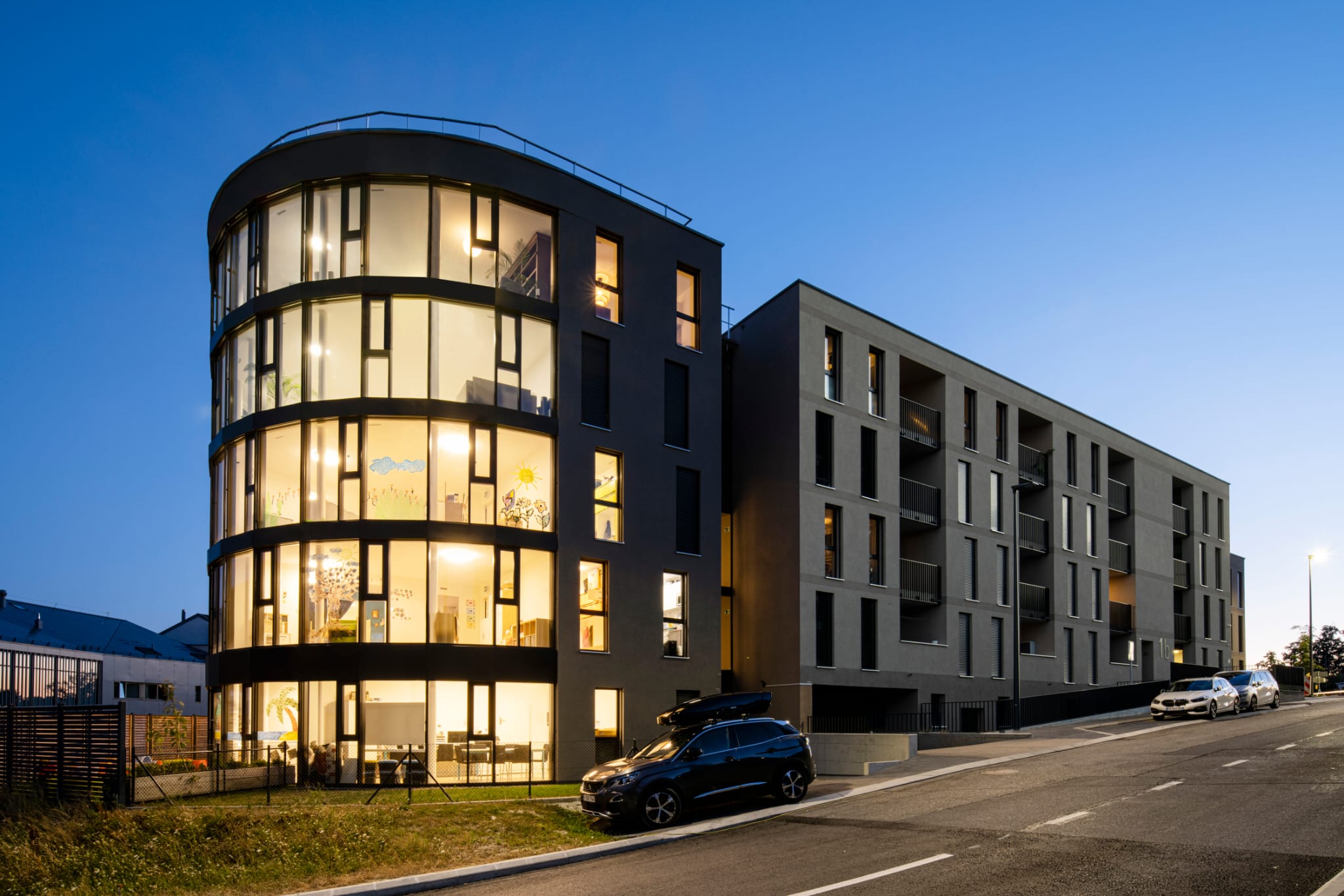 SwissHelios headquarters at dusk, Route du Village 4, Epalinges